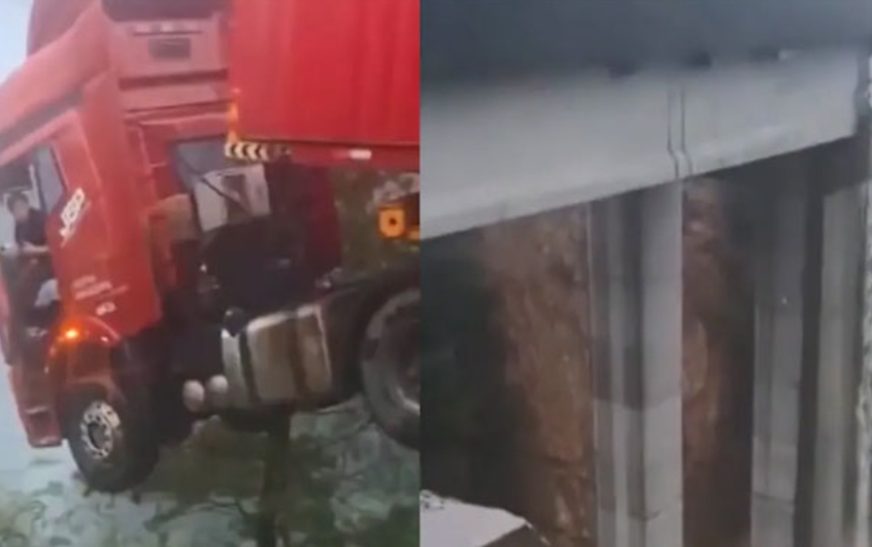 കനത്ത മഴയിലും മണ്ണിടിച്ചിലിലും തകർന്ന ഹൈവേ പാലത്തിൽ തൂങ്ങിക്കിടന്ന് ട്രക്ക്