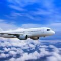 plane-in-the-sky-passenger-commercial-plane-flying-above-the-clouds-concept-of-fast-travel-vacation-and-business-photo